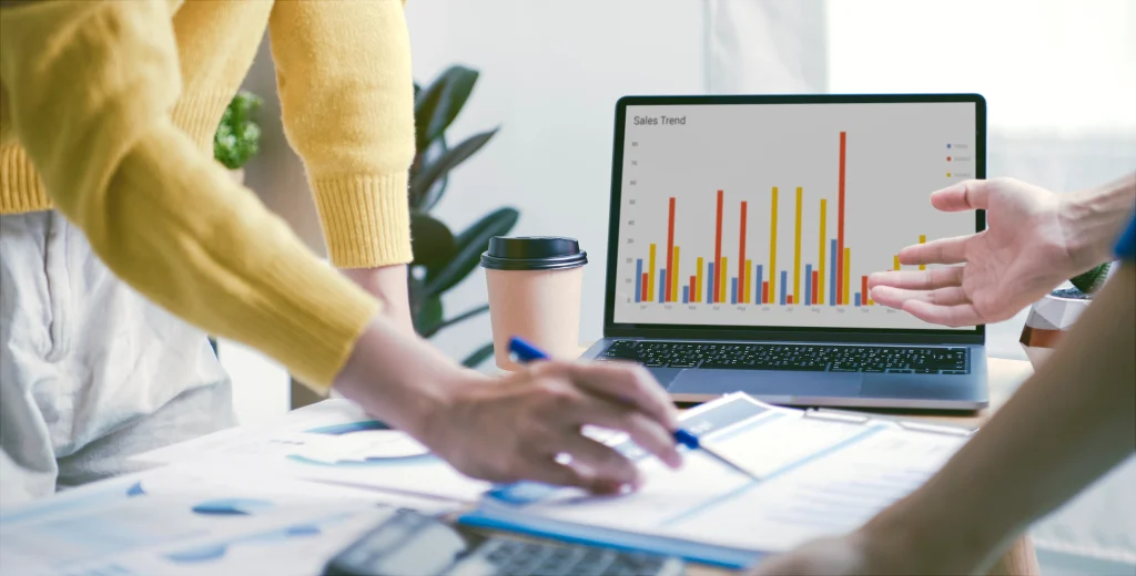 A focused business professional analyzing financial reports, representing the enhancement of financial management skills for business growth.